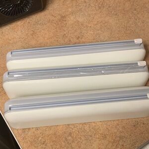 Kitchen roll storage. Foil, wax paper, plastic wrap